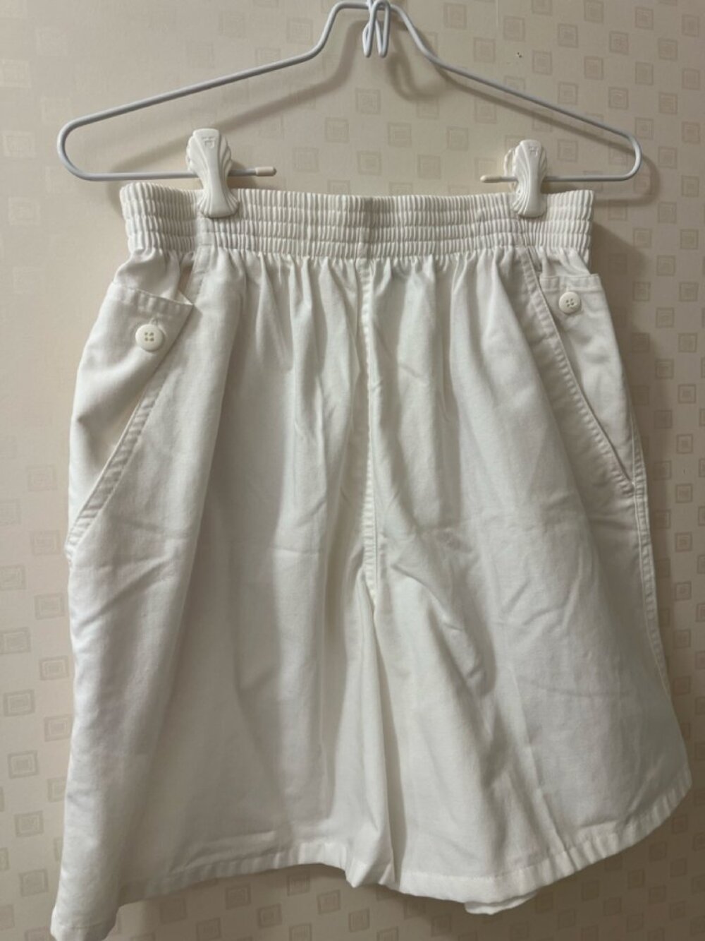 Vintage high-waisted shorts with side button flap pockets